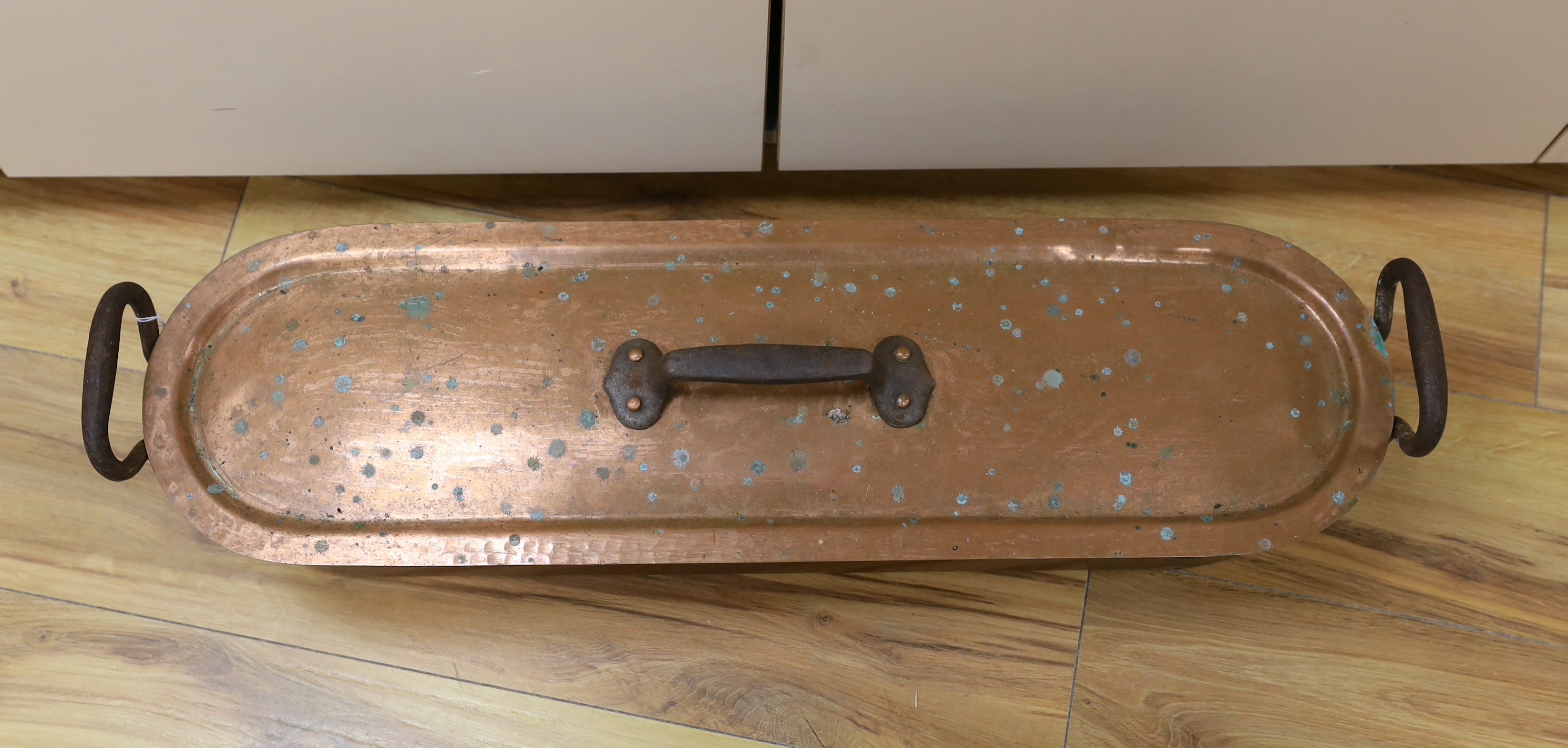 A planished copper fish kettle, 76cm